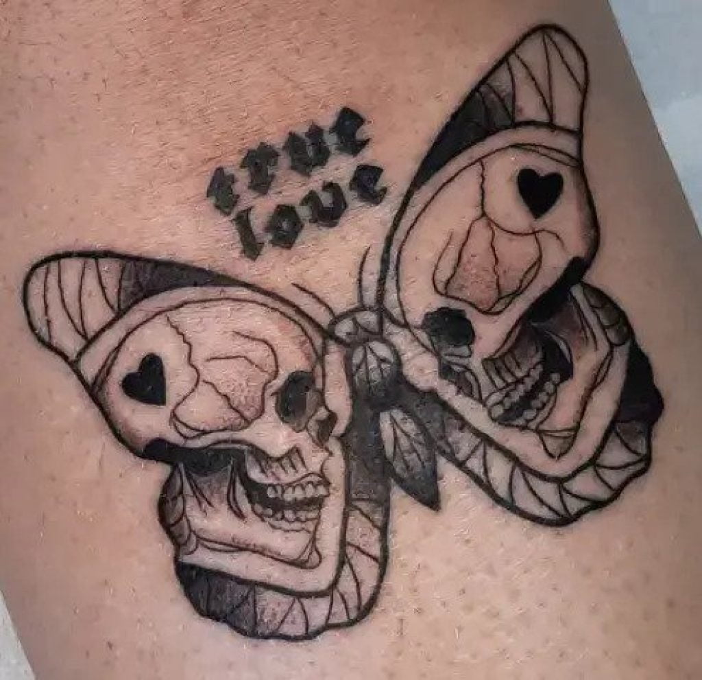 Skull butterfly neck tattoo